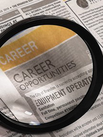 magnifying glass on a newspaper